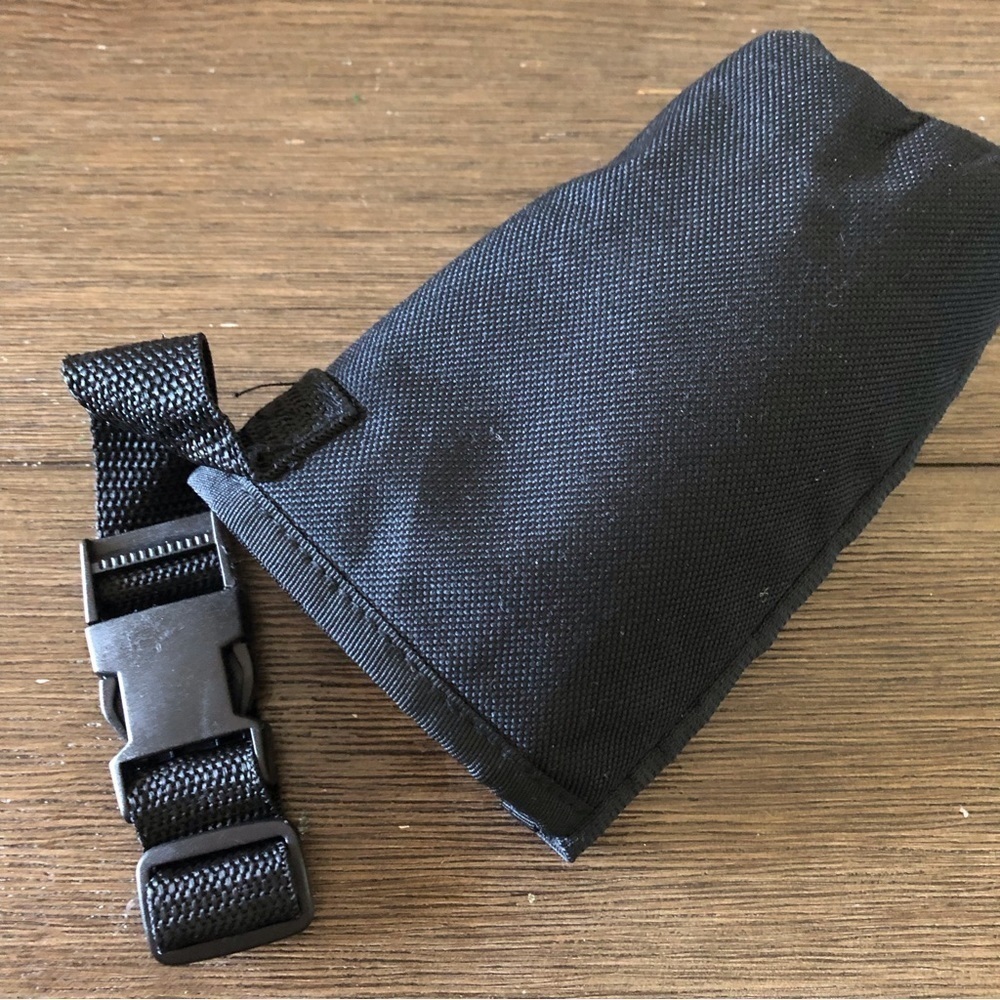 Black water bottle holder with buckle attachment for bike